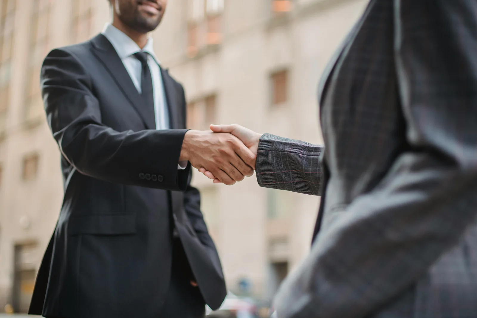 Two business partners shaking hands.